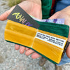 An open wallet contains an Analog business card, cash, and a bike fitting card